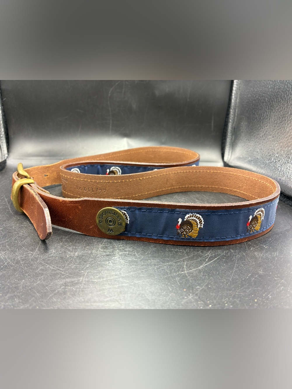 Sportsman brown belt with turkeys embroidered on ribbon on belt 51” long
